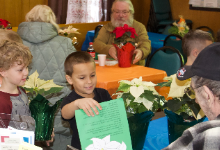 boys deliver gifts to seniors