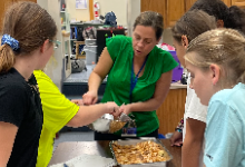 teacher and students in baking class