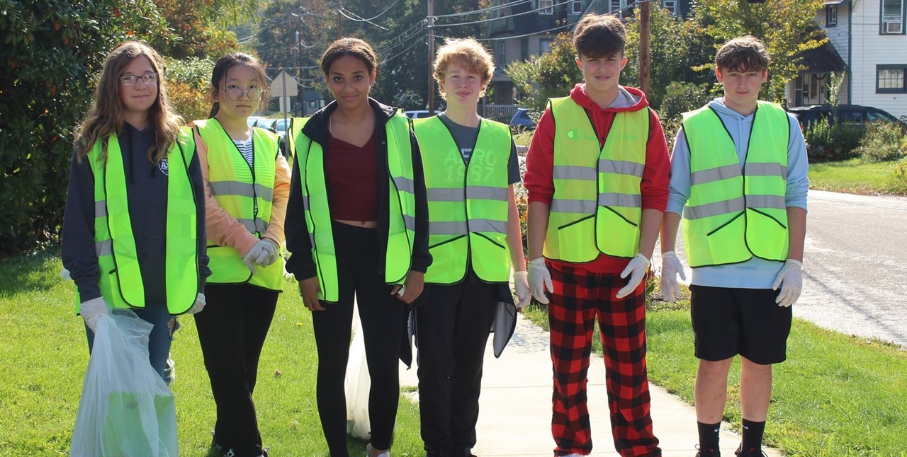 students participating in community clean up