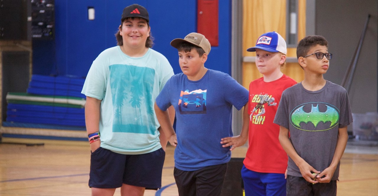 Students in gym getting ready to play a game
