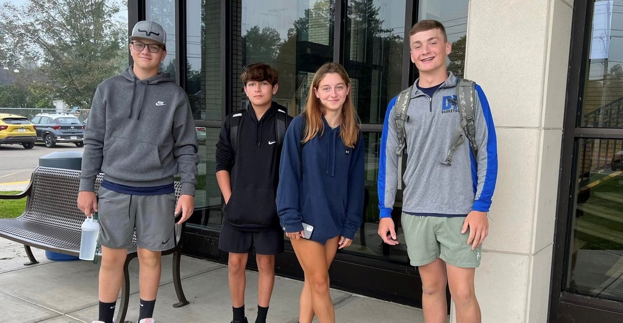 four students on the first day of school