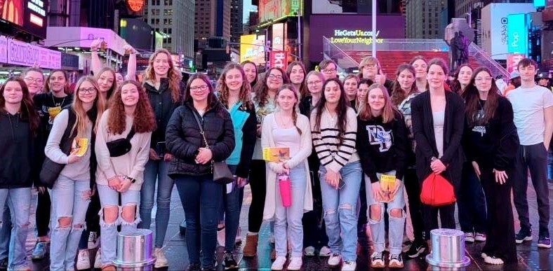 Group of students pose for picture in Times Square